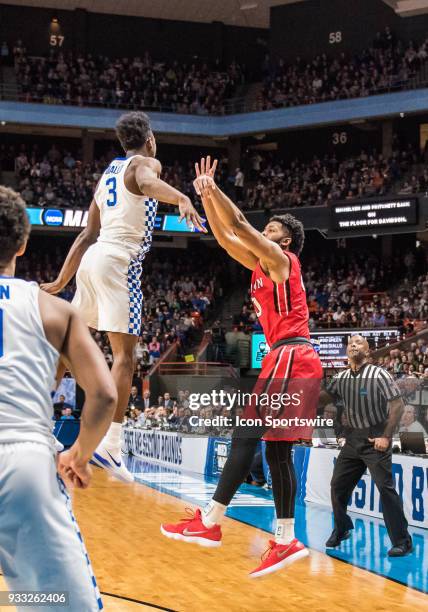 Hamidou Diallo of the Kentucky Wildcats misses a block on a three point shot by G KiShawn Pritchett of the Davidson Wildcats during the NCAA Division...