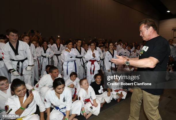 Arnold Schwarzenegger speaks with martial art athletes during the Arnold Sports Festival Australia at The Melbourne Convention and Exhibition Centre...