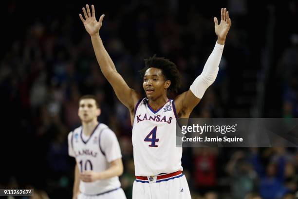 Devonte' Graham of the Kansas Jayhawks reacts against the Seton Hall Pirates in the second half during the second round of the 2018 NCAA Men's...