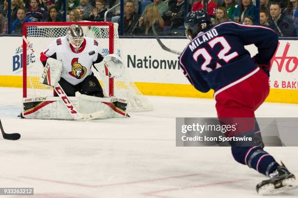 Columbus Blue Jackets left wing Sonny Milano attempts a shot on goal as Ottawa Senators goaltender Mike Condon defends in the third period of a game...