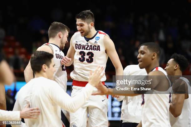 Killian Tillie and Corey Kispert of the Gonzaga Bulldogs celebrate defeating the Ohio State Buckeyes 90-84 in the second round of the 2018 NCAA Men's...