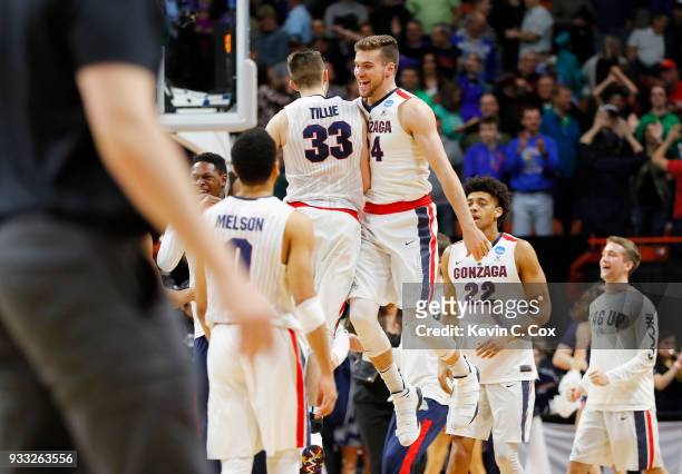 Killian Tillie and Corey Kispert of the Gonzaga Bulldogs celebrate defeating the Ohio State Buckeyes 90-84 in the second round of the 2018 NCAA Men's...