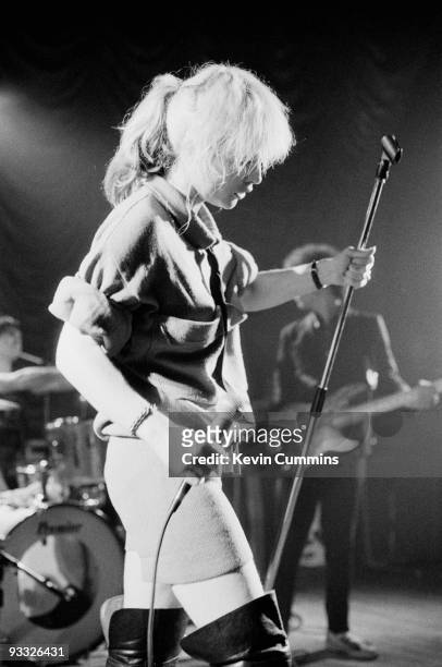 Singer Debbie Harry of American band Blondie, wearing shorts and thigh high boots, performs on stage at King George's Hall in Blackburn on February...