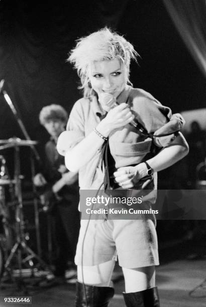 Singer Debbie Harry of American band Blondie, wearing shorts and thigh high boots, performs on stage at King George's Hall in Blackburn on February...