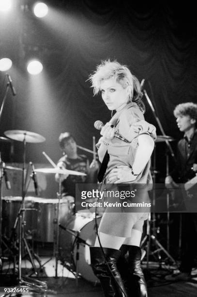 Singer Debbie Harry of American band Blondie, wearing shorts and thigh high boots, performs on stage at King George's Hall in Blackburn on February...