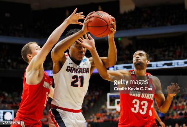 Rui Hachimura of the Gonzaga Bulldogs battles for the ball with Andrew Dakich and Keita Bates-Diop of the Ohio State Buckeyes during the second half...