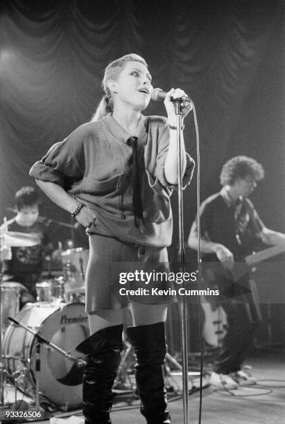 Singer Debbie Harry with drummer Clem Burke and bassist Nigel Harrison of American band Blondie perform on stage at King George's Hall in Blackburn...