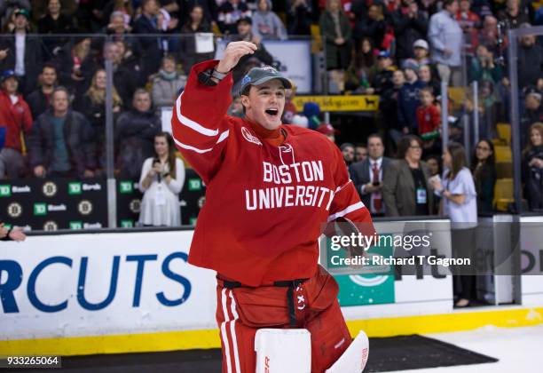 Jake Oettinger of the Boston University Terriers celebrates after being named most valuable player after the Terriers won the Hockey East...