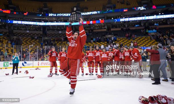 Drew Melanson of the Boston University Terriers celebrates after being named most valuable player after the Terriers won the Hockey East Championship...