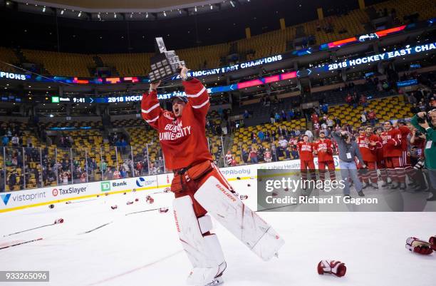 Jake Oettinger of the Boston University Terriers celebrates after the Terriers won the Hockey East Championship against the Providence College Friars...