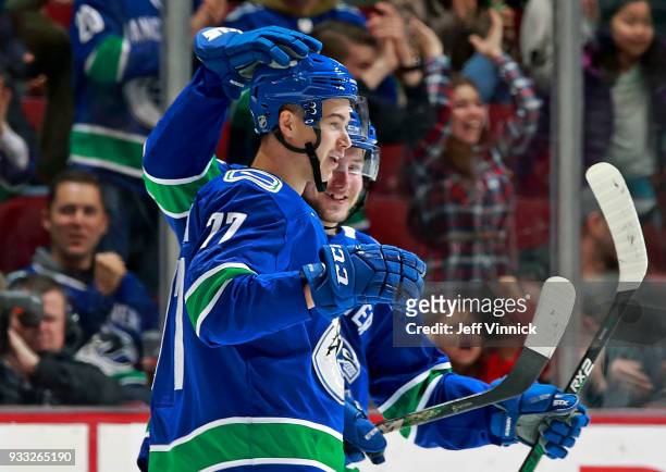 Nikolay Goldobin of the Vancouver Canucks is congratulated after scoring during their NHL game against the San Jose Sharks at Rogers Arena March 17,...