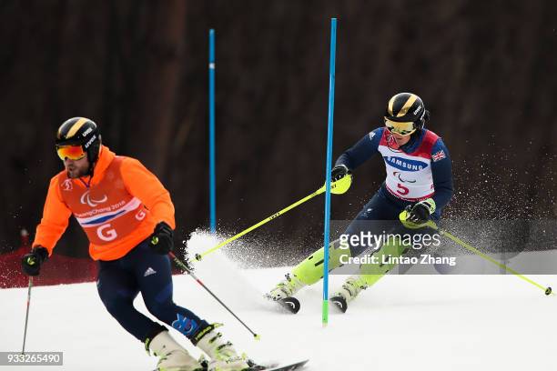 Millie Knight of Great Britain and her guide Brett Wild compete in the Women's Visually Impaired Slalom at Jeongseon Alpine Centre on Day 9 of the...