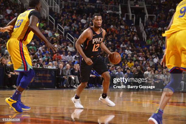 Warren of the Phoenix Suns handles the ball against the Golden State Warriors on March 17, 2018 at Talking Stick Resort Arena in Phoenix, Arizona....