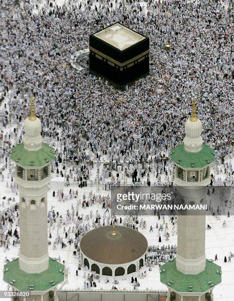 Muslim pilgrims go around the Kaaba in Mecca following the stoning ritual in Mina 06 March 2001, a day after 35 people were killed in a stampede. The...