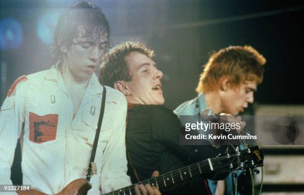 Mick Jones, Joe Strummer and Paul Simonon of English punk band The Clash perform on stage at the Elizabethan Hall, Belle Vue, Manchester in December...