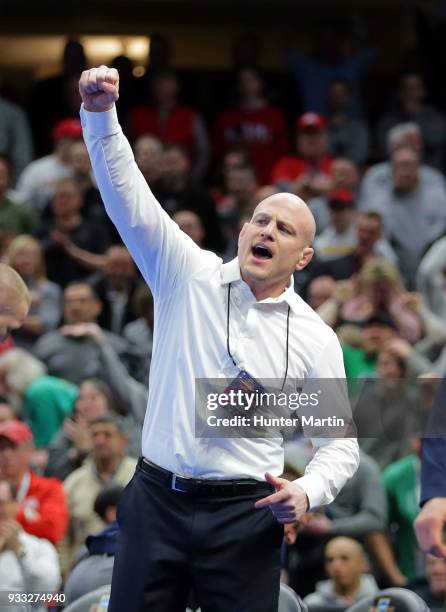 Head coach Cael Sanderson of the Penn State Nittany Lions celebrates after Bo Nickal won the 184 pound championship match and clinched the team title...
