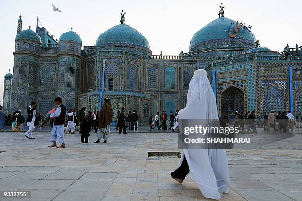Burqa-clad woman walks at the Hazrat Ali Shrine in the northern town of Mazar-i-Sharif in Balkh province on March 19, 2009. Tens of thousands of...