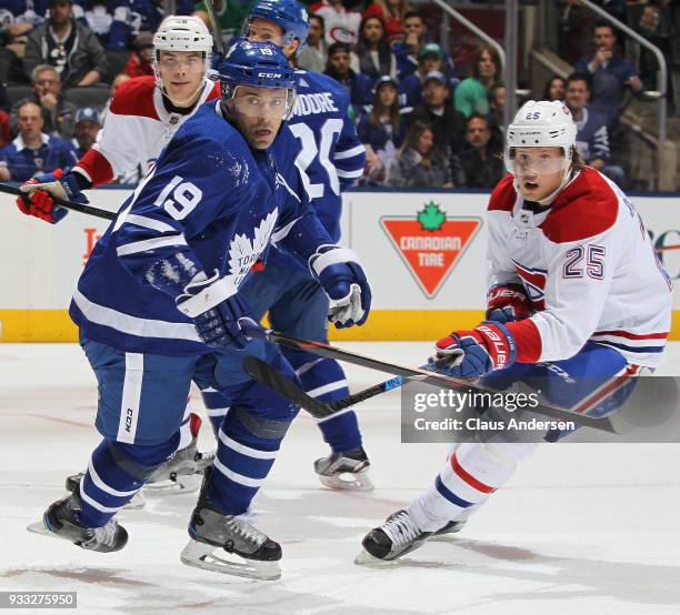 Jacob de la Rose of the Montreal Canadiens skates against Tomas Plekanec of the Toronto Maple Leafs during an NHL game at the Air Canada Centre on...