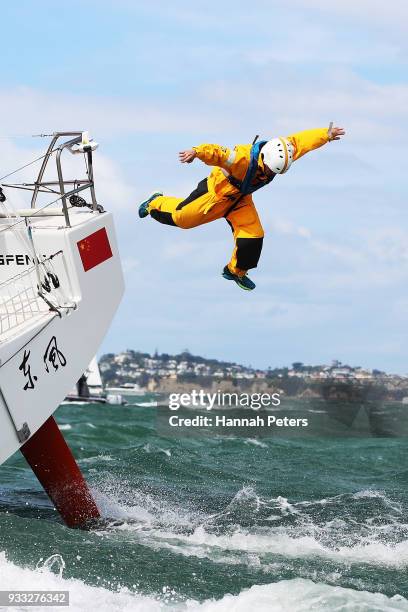 Guy Heveldt jumps off Dongfeng Race Team during the departure ahead of leg seven of the Volvo Ocean Race on March 18, 2018 in Auckland, New Zealand.