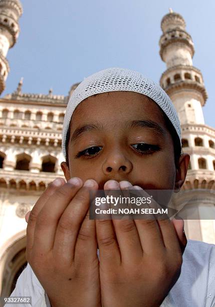 Young Indian Muslim boy offers the final Friday Prayers in the fasting month of Ramadan in Hyderabad, 20 October 2006. Ramadan, which is currently...