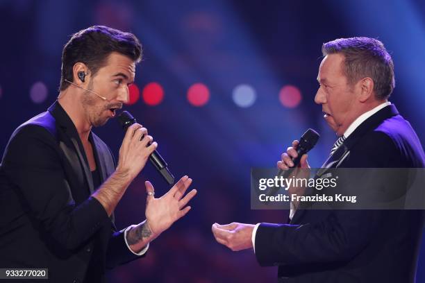 Roland Kaiser and Florian Silbereisen perform during the TV show 'Heimlich! Die grosse Schlager-Ueberraschung' on March 17, 2018 in Munich, Germany.