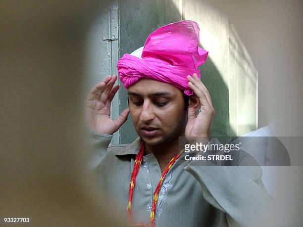 Pakistani cricketer Faisal Iqbal offers prayers at The Dargah of Hazrat Khwaja Moinuddin Chisty in Ajmer, 18 October 2006. Iqbal is in India with his...