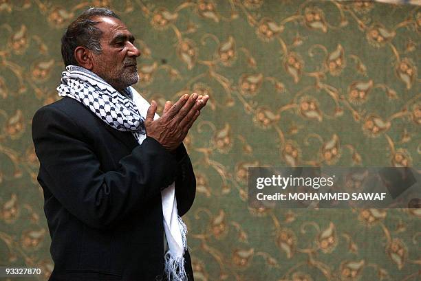 Shiite Muslim Iraqi man prays at the Imam Hussein mosque in the southern city of Karbala some 120 kms from Baghdad on November 14, 2008. Iraq's top...