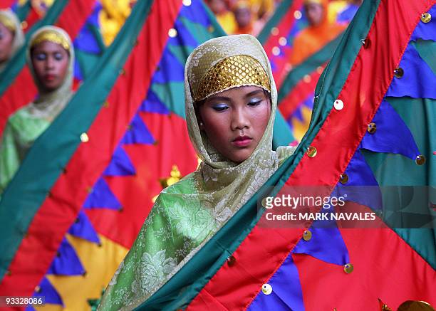 Filipino Muslim students parade in their colourful costumes during the annual T'nalak Festival in Koronadal, the capital of South Cotabato province...