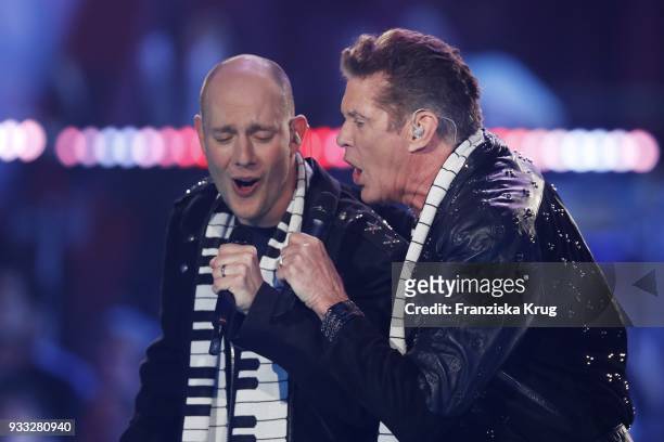 Oli P. And David Hasselhoff perform during the TV show 'Heimlich! Die grosse Schlager-Ueberraschung' on March 17, 2018 in Munich, Germany.