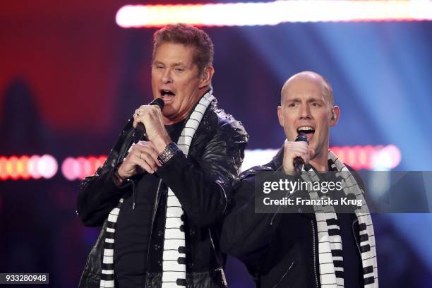 David Hasselhoff and Oli P. Perform during the TV show 'Heimlich! Die grosse Schlager-Ueberraschung' on March 17, 2018 in Munich, Germany.