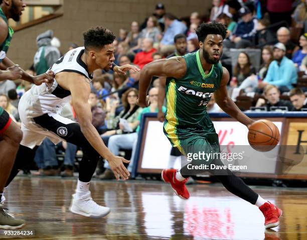 Derrick Walton Jr. #10 of the Sioux Falls Skyforce handles the ball against Olivier Hanlan from the Austin Spurs during an NBA G-League game on March...