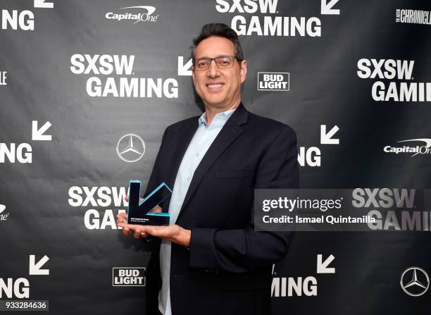 Chris Mancil poses with the Excellence in Convergence award at SXSW Gaming Awards during SXSW at Hilton Austin Downtown on March 17, 2018 in Austin,...