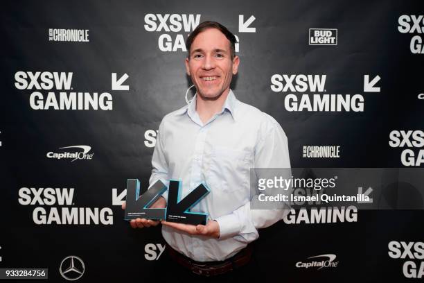 Tyler Moldenhauer poses with the award for Excellence in Animation and Excellence in Art at SXSW Gaming Awards during SXSW at Hilton Austin Downtown...