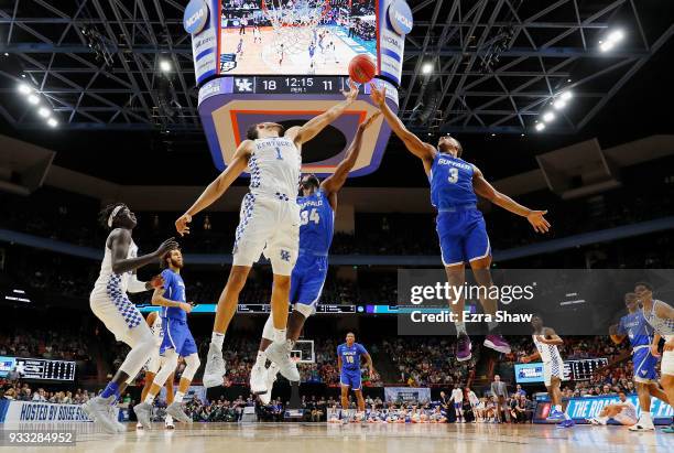 Sacha Killeya-Jones of the Kentucky Wildcats battles for a rebound with Ikenna Smart and Jayvon Graves of the Buffalo Bulls in the second round of...