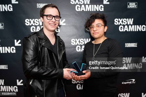 Harris Foster and Jocelyn Reyes pose with their award at SXSW Gaming Awards during SXSW at Hilton Austin Downtown on March 17, 2018 in Austin, Texas.