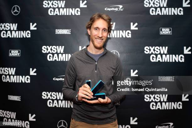Ian Dallas poses with an award at SXSW Gaming Awards during SXSW at Hilton Austin Downtown on March 17, 2018 in Austin, Texas.