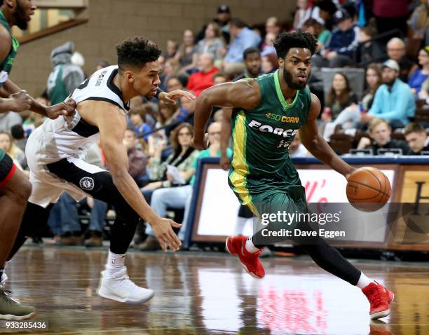 Derrick Walton Jr. #10 of the Sioux Falls Skyforce gets a step past Olivier Hanlan from the Austin Spurs during an NBA G-League game on March 17,...