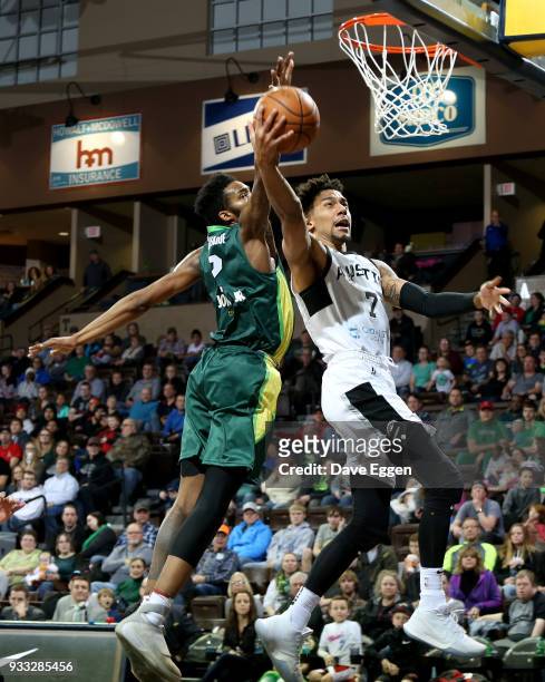 Olivier Hanlan from the Austin Spurs takes the ball to the basket against Derrick Jones Jr. #2 from the Sioux Falls Skyforce during an NBA G-League...