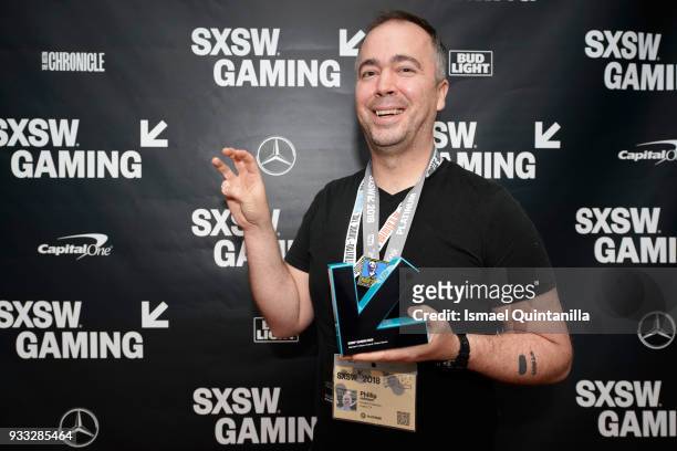 Phillip Johnson poses with an award at SXSW Gaming Awards during SXSW at Hilton Austin Downtown on March 17, 2018 in Austin, Texas.