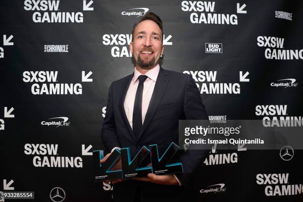 Brendan Greene poses with the awards for Esports Game of the Year, Trending Game of the Year and Excellence in Multiplayer backstage at SXSW Gaming...