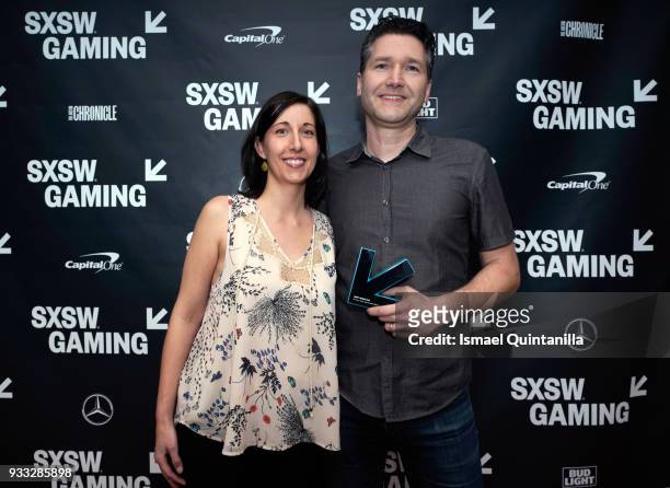 Paulette Denman and Stu Denman pose with the Gamer's Voice Award: Mobile Game backstage at SXSW Gaming Awards during SXSW at Hilton Austin Downtown...