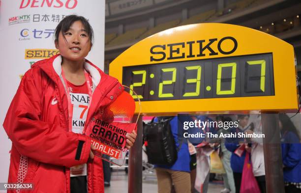 Hanami Sekine of Japan celebrates her third finish after the Nagoya Women's Marathon 2018 at Nagoya Dome on March 11, 2018 in Nagoya, Aichi, Japan.