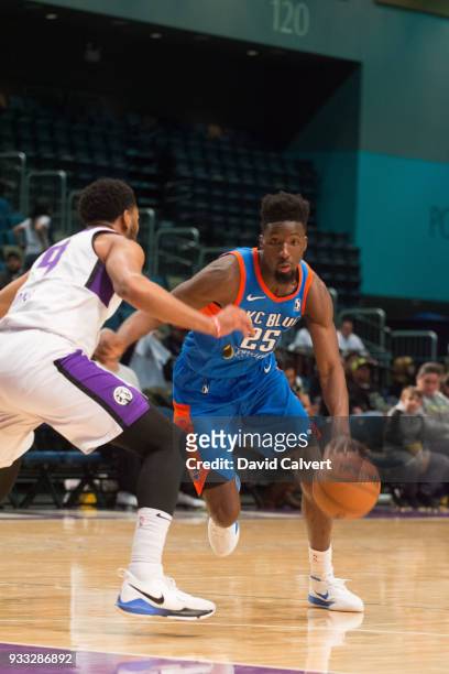 Daniel Hamilton of the Oklahoma City Blue dribbles into a Reno Bighorns defender during an NBA G-League game on March 17, 2018 at the Reno Events...