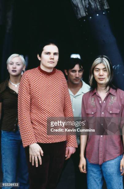 Posed group portrait of American rock band the Smashing Pumpkins in Los Angeles in August 1995. Left to right are bassist D'Arcy Wretzky, singer...