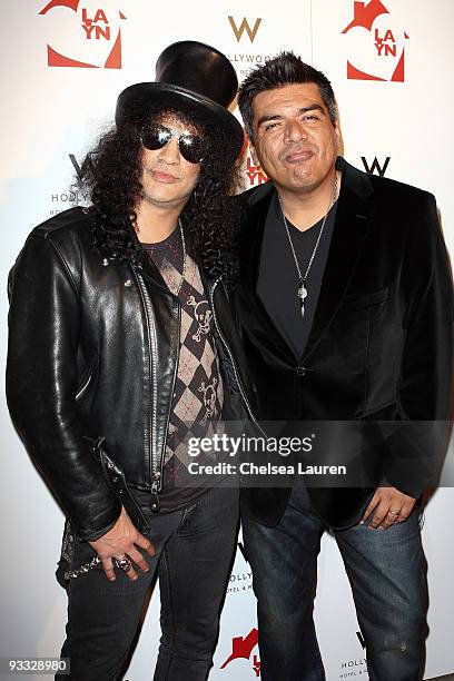 Guitarist Slash of Velvet Revolver and comedian George Lopez arrive at the Los Angeles Youth Network benefit concerts at Avalon on November 22, 2009...