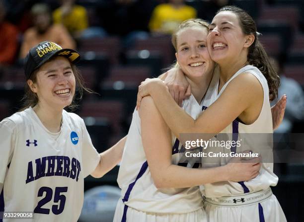 Hannah Fox, Emma McCarthy and Cam Hendricks of Amherst College celebrated with the team after winning the Division III Women's Basketball...