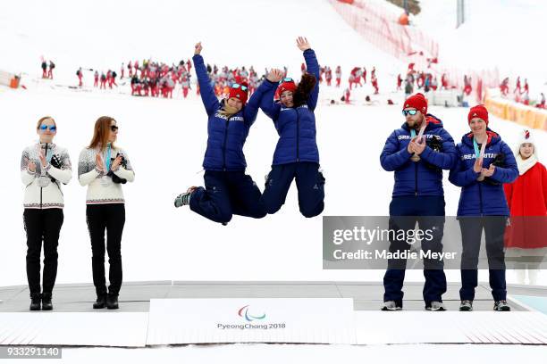 From left, silver medalist guide Natalia Subrtova and skier Henrieta Farkasova of Slovakia, gold medalist guide Jennifer Kehoe and skier Menna...