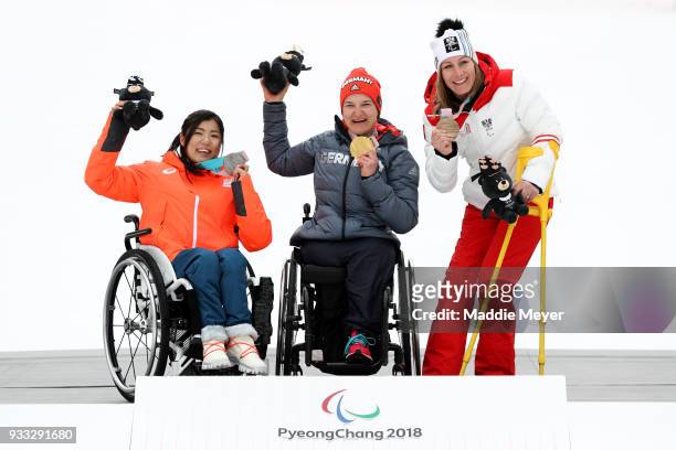 From left, silver medalist Momoka Muraoka of Japan, gold medalist Anna-Lena Forster of Germany and bronze medalist Heike Eder of Austria celebrate...