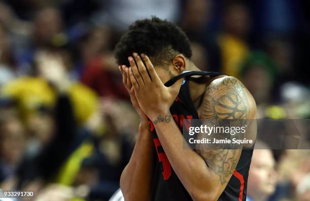 Devin Davis of the Houston Cougars reacts to their 63-64 loss to the Michigan Wolverines in the second half during the second round of the 2018 NCAA...