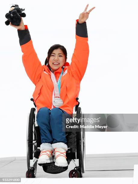 Momoka Muraoka of Japan celebrates after receiving her silver medal in the Women's Sitting Slalom at Jeongseon Alpine Centre on Day 9 of the...